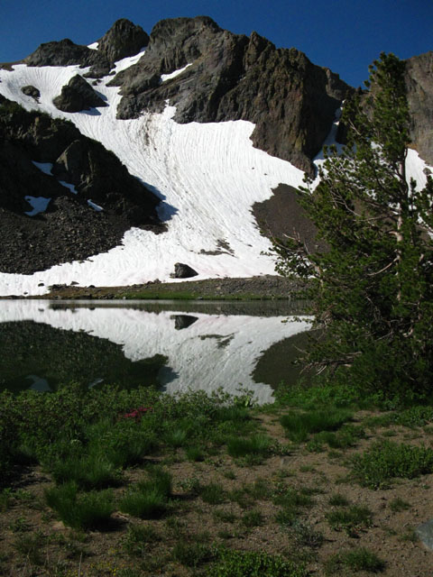 The Western Sister, draped in snow and reflected in Round Top Lake